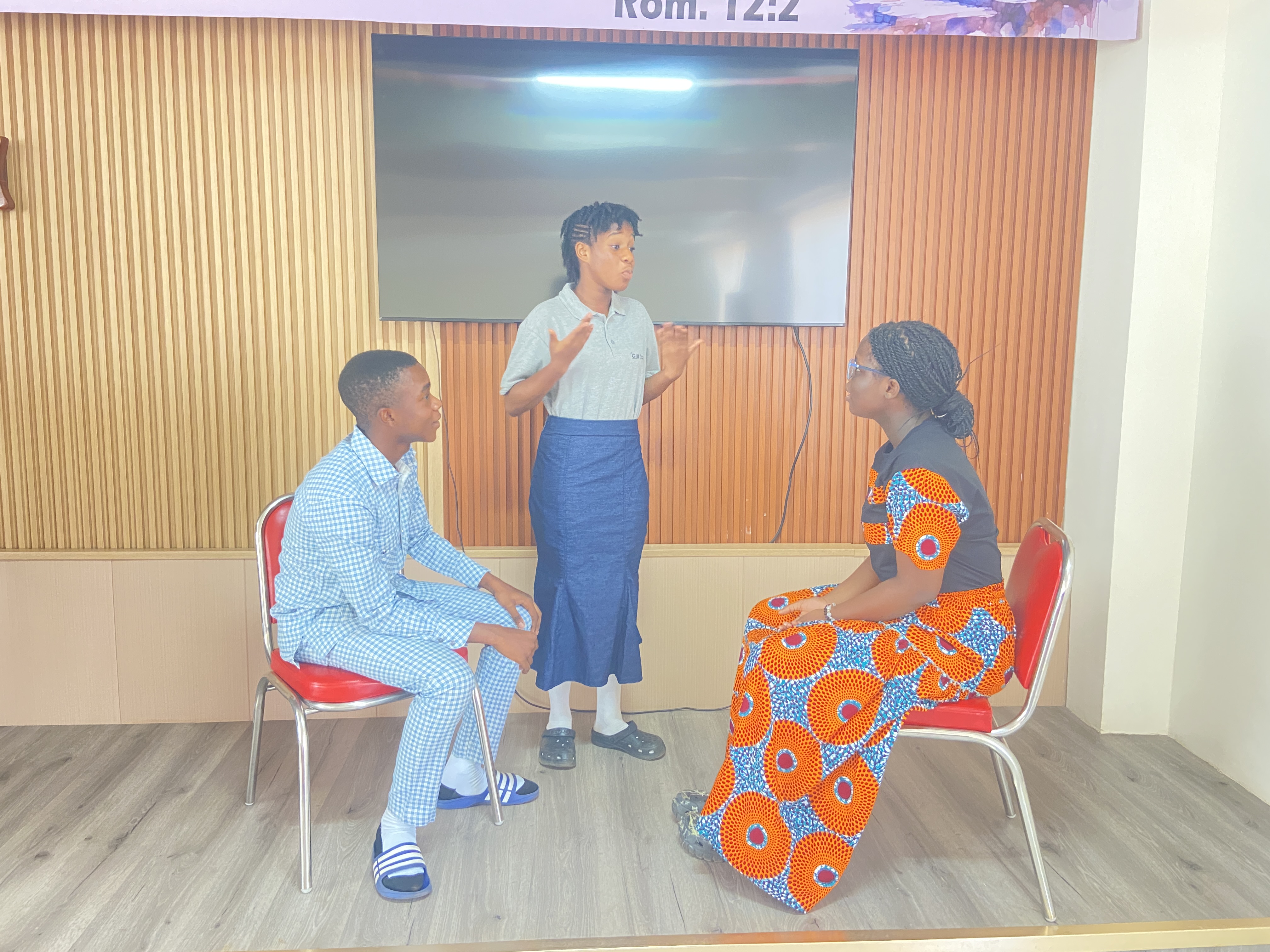 GIU high school students performing and presenting